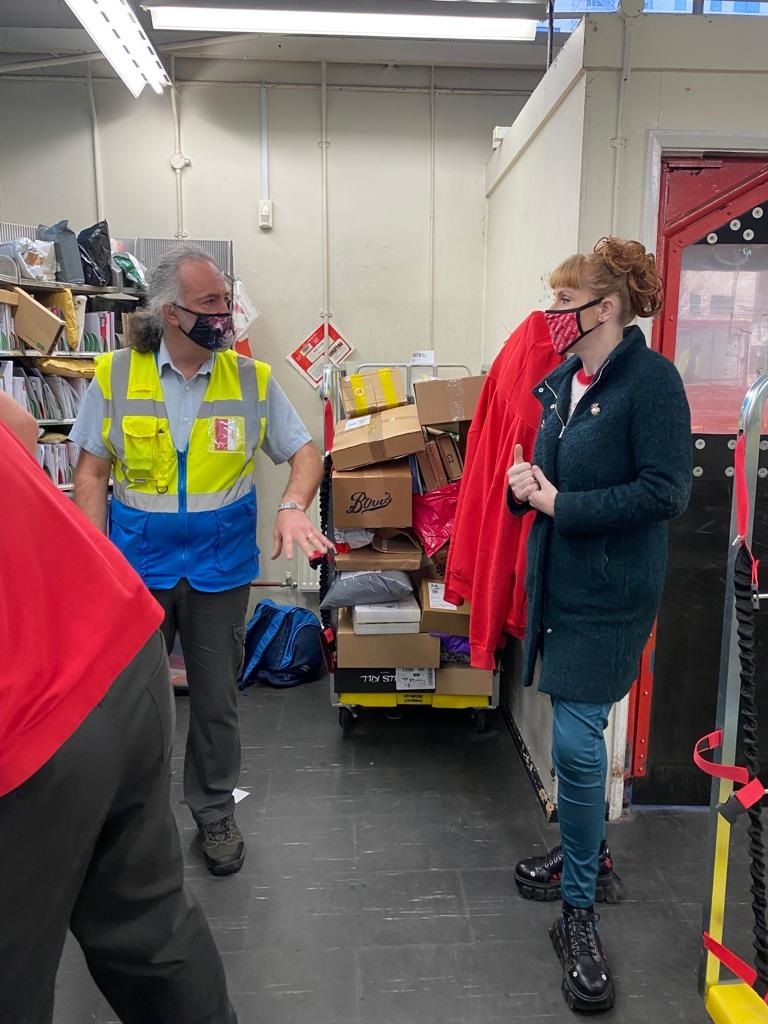 Angela Rayner speaking with a staff member at the Ashton delivery office