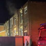Footage of the fire shows smoke pouring out of a second-storey window