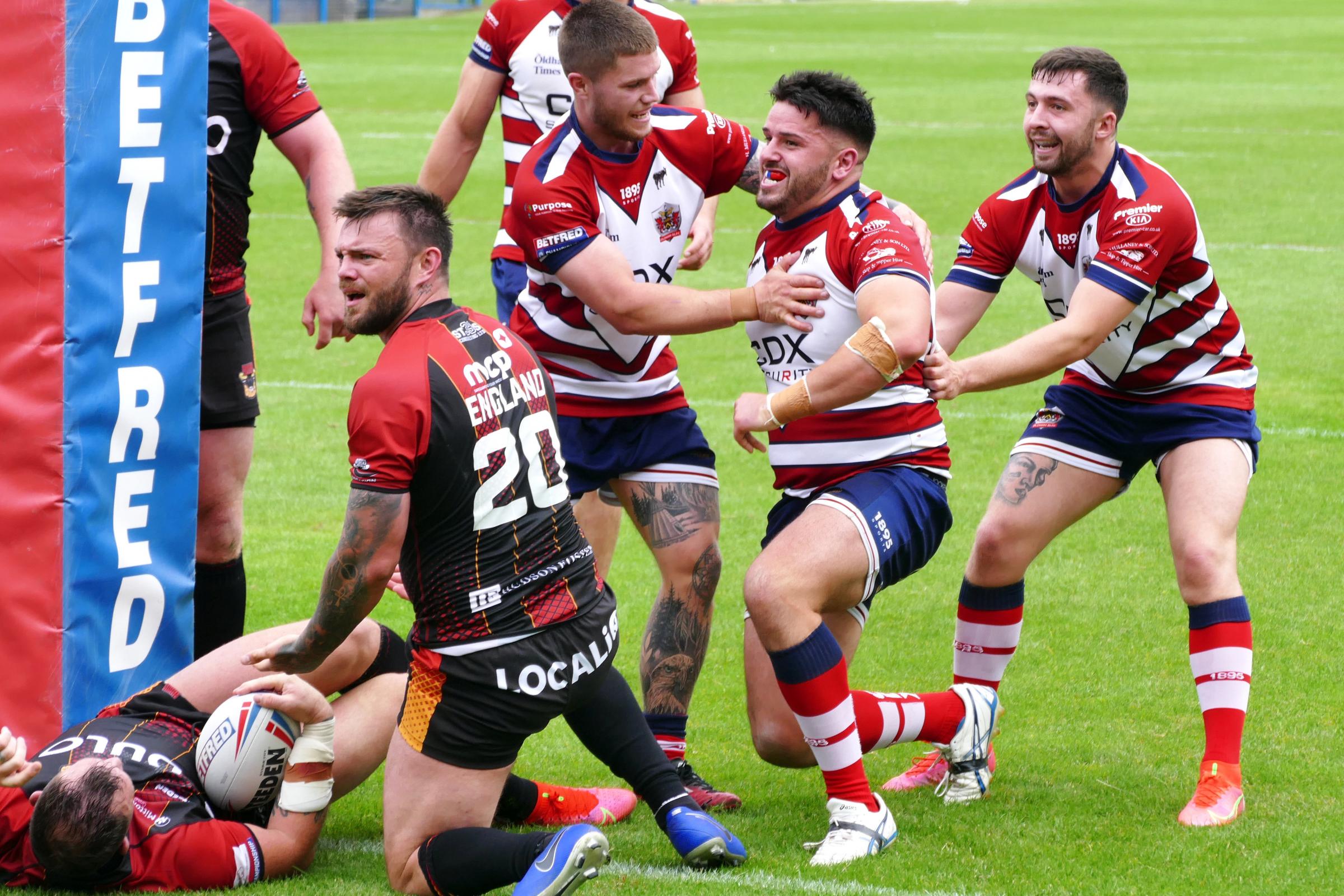Martyn Reilly is congratulated by teammates after scoring his try