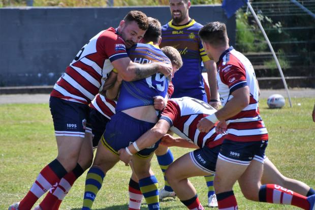 Oldham battle for possession at Whitehaven. Picture: Ben Challis