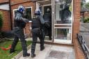Officers executing warrants on Thursday morning