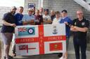 Members of the Veterans Supporters Group with Oldham Athletic owner Frank Rothwell, third from left