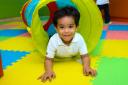 Photo of a child enjoying soft play activities