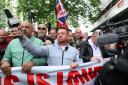Tommy Robinson, whose real name is Stephen Yaxley Lennon, leads a protest march through London (David Parry/PA)