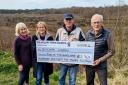 From left, Helen Battilana, Georgie Johnson, Town Mayor Cllr Jon Newell and John Handley donate a community grant of £12,945 to Discover Lindow