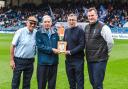 Roy Butterworth receives his award from Colin Bridgford, CEO of Manchester FA, watched by Frank Rothwell (left) and Darren Royle