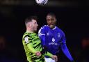 Oldham Athletic's Dylan Bahamboula competes with Nicky Cadden of Forest Green Rovers during the EFL2 game at Boundary Park between Oldham and Forest Green Rovers.