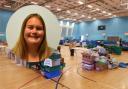 The food bank's base at Oldham Leisure Centre’s sports hall during the pandemic and Rebecca Kershaw, inset