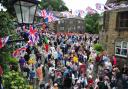 Villagers gather in Dobcross Square for a service before setting off to join other churches in their Whit Walk to Uppermill (Pictures Paul Clegg and Laura-Daisy Bennett)