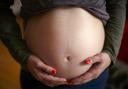 A pregnant person. Photo: PA