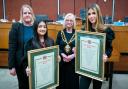 Keira-Louise Arnold (left) and Hannah Miah (right) with their civic appreciation awards in front of Cllr Amanda Chadderton and Mayor Cllr Elaine Garry