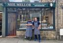 Neil with son Josh outside the shop