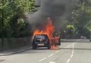 The car was seen engulfed in flames on a road in Shaw yesterday