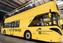 Mayor Andy Burnham pictured on a yellow Bee Network bus