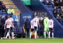 Bolton Wanderers players leave the pitch after the game is abandoned on Saturday