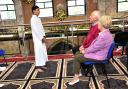 Ehsan Tahir recites a poem to visitors Peter and Judith Killan during an open day at Greengate Jamia Masjid, Oldham.