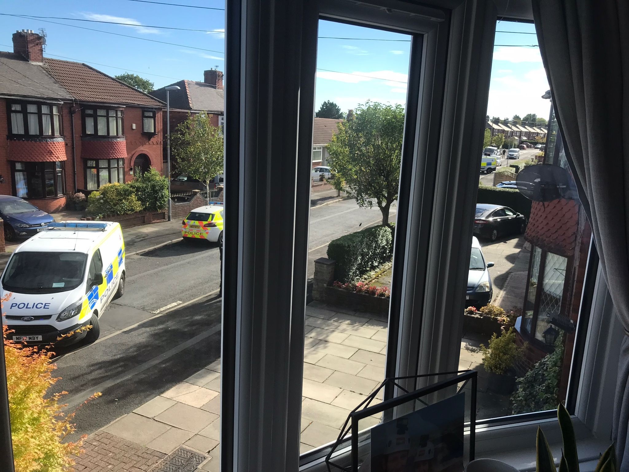 Police on Kew Road in Failsworth on Wednesday