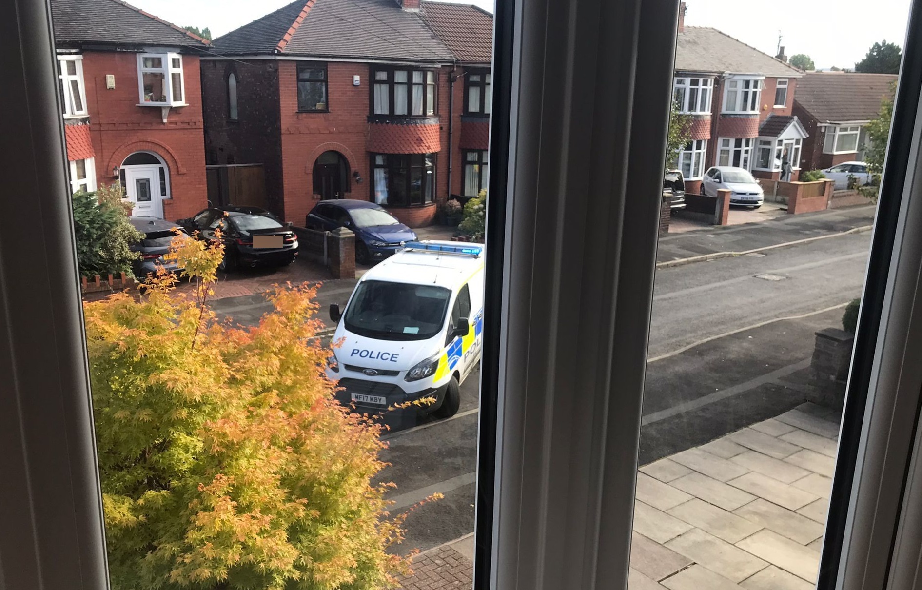 Police on Kew Road in Failsworth on Wednesday