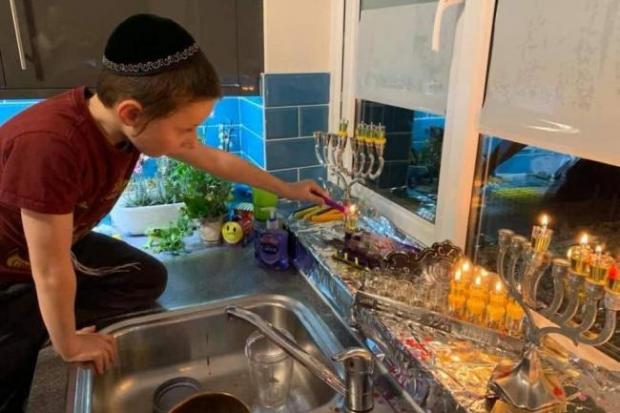 A boy celebrating Hanukkah (Picture: PA)