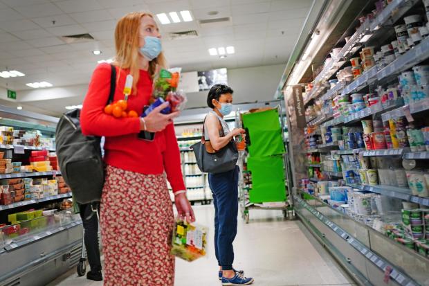 The Oldham Times: Shoppers in a supermarket (PA)
