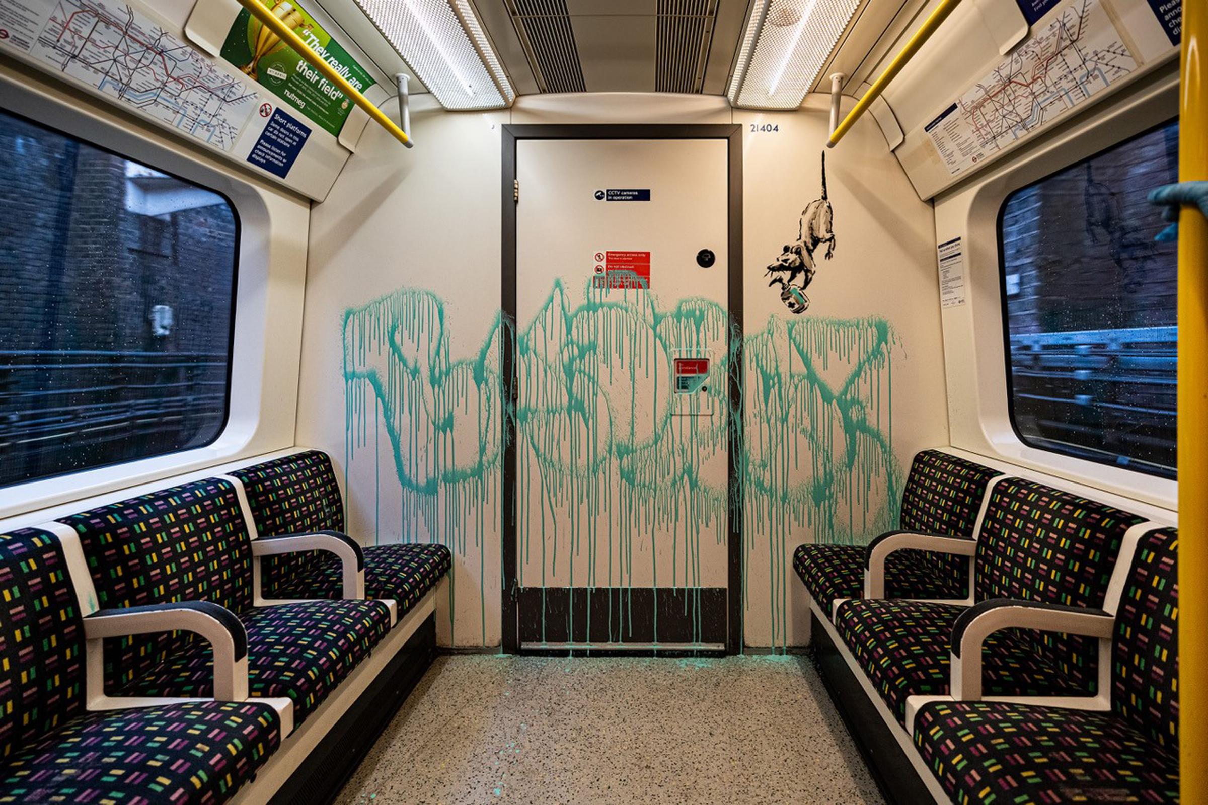 A Banksy work on a London Underground tube, highlighting the spread of coronavirus in July 2020 (Image: PA).