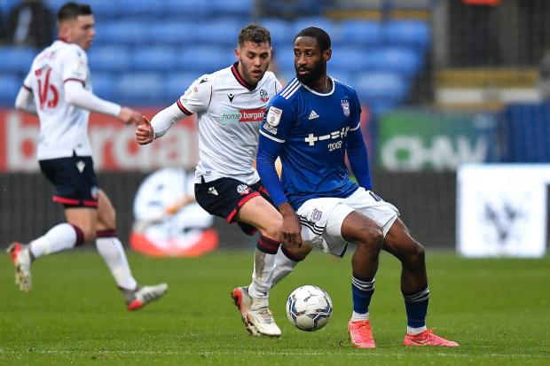 Ipswich Town's Janoi Donacien vies for possession with Bolton Wanderers' Dion Charles