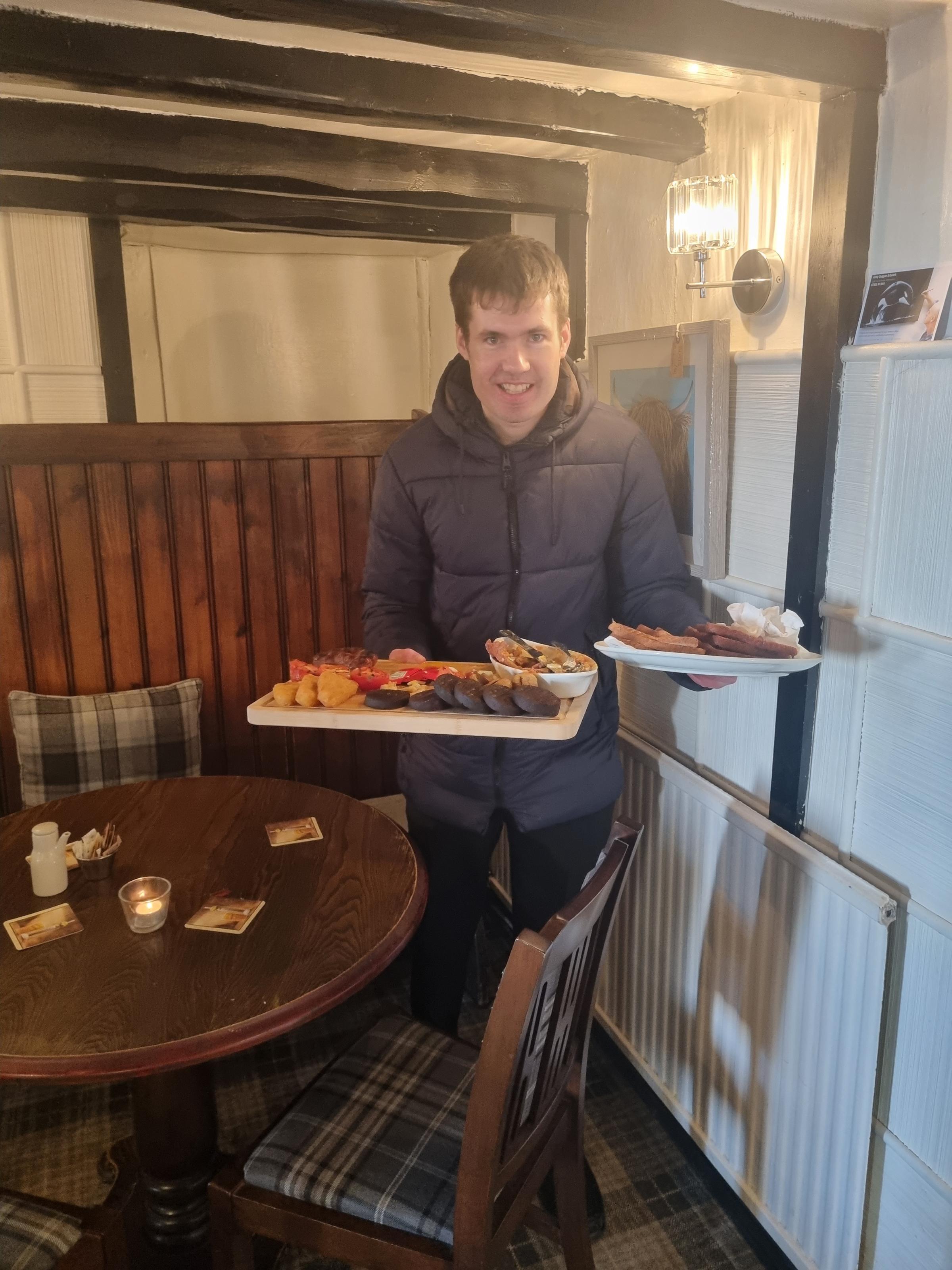 Reporter James Mutch with the half-completed plate of food