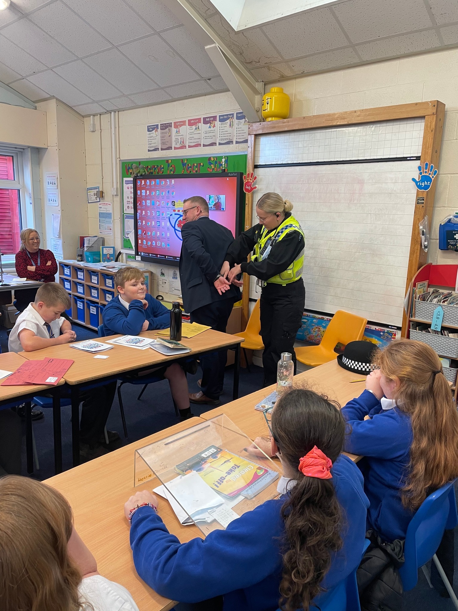 Police officers with children at Parkfield Primary School in Middleton