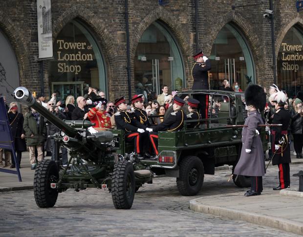 The Oldham Times: Members of the Honourable Artillery Company fire a gun salute from the wharf at the Tower of London to mark the official start of the Platinum Jubilee. Picture: PA