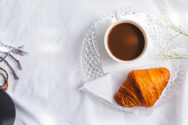 The Oldham Times: A croissant and a coffee (Canva)