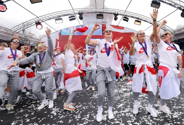 The Oldham Times: England players sing Sweet Caroline on stage during a fan celebration to commemorate England's historic UEFA Women's EURO 2022 triumph in Trafalgar Square. Credit: PA
