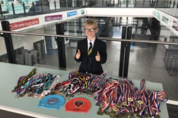 The Oldham Times: Lee with his collection of medals at Oasis Academy Oldham.
