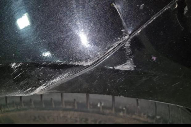 The Oldham Times: An image appears to show a large gash or dent in the side of a vehicle, caused by a violent attack.