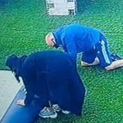 A screenshot of the CCTV footage which appears to show the thieves removing the section of grass