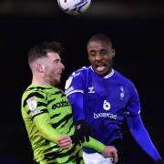 Oldham Athletic's Dylan Bahamboula competes with Nicky Cadden of Forest Green Rovers during the EFL2 game at Boundary Park between Oldham and Forest Green Rovers.