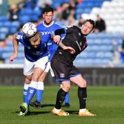 Carl Piergianni puts his head in where it hurts for Oldham against Carlisle