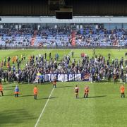 Hundreds of fans staged a pitch invasion and protest