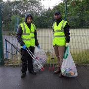 Salehuddin Talukdar (right) with volunteers on the streets of Oldham
