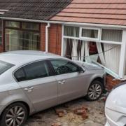 The car allegedly crashed through a garden wall and into the front of the house