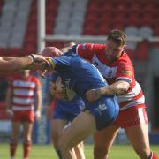 Jamie Ellis on tackling duty on his debut for Roughyeds in the defeat at Doncaster Picture: Dave Murgatroyd