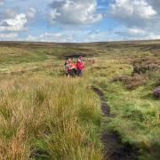 Oldham and Glossop mountain rescue teams worked together to help the young woman