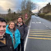 Saddleworth West and Lees Councillors Alicia Marland, Sam Al Hamdani and Mark Kenyon in front of the new rumble strips on Under Lane, Grotton. Supplied by councillors