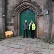 Vicar Daniel Burton and Stuart Lowe, contacts director at Rowan Ashworth Ltd, stand on the new ramp