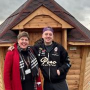 Alison Tootill and Aitch outside the Harrison's Hut