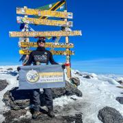 Akke Rahman at the top of Mt Kilimanjaro