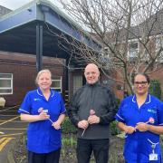 Steve Gallagher supporting Dr Kershaw’s Rose to Remember Appeal  in memory of his sister Debby with staff nurses, Sam and Bindhu