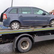 The blue Vauxhall was towed away by the force today