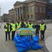 Members of Ahmadiyya Muslim Youth Oldham clean streets in Oldham Town Centre on New Years Day 2018
