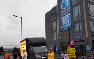 Picketers outside Oldham College on Tuesday