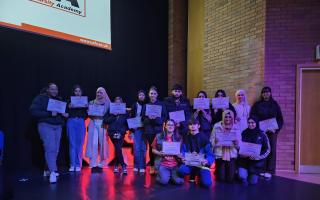 Students from Hathershaw College accepting their certificates